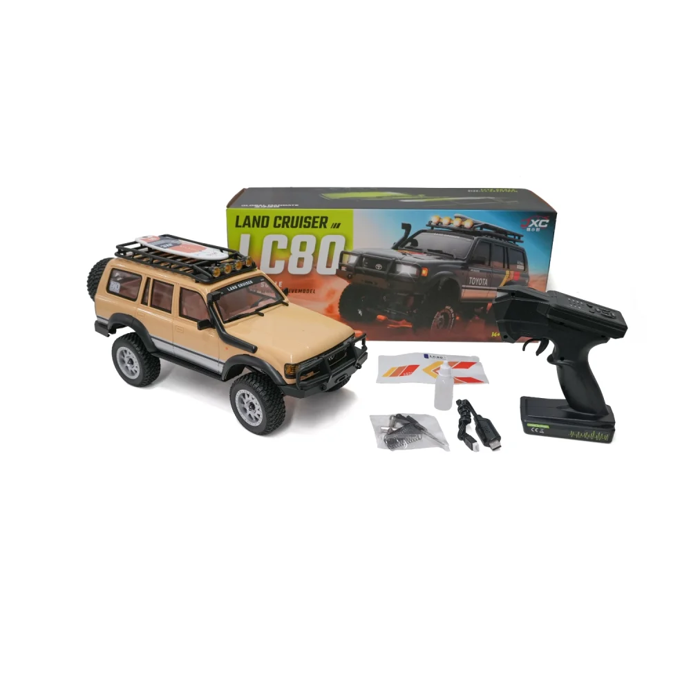 1:12 LC80 Land Cruiser RC crawler with retail box, remote, USB cable, and accessories.
