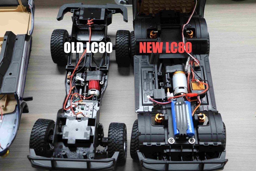 Old vs new JXC 1:12 crawler chassis top-down comparison showing internal layout and LiFePO4 battery
