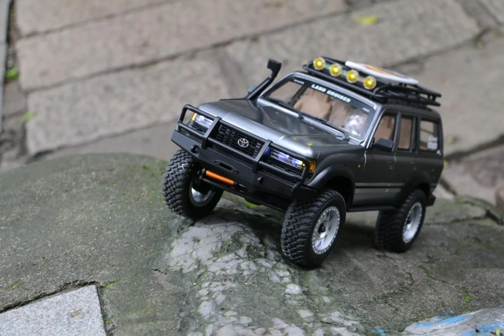 JXC LC80 1:12 crawler climbing rocks during real world R&D testing