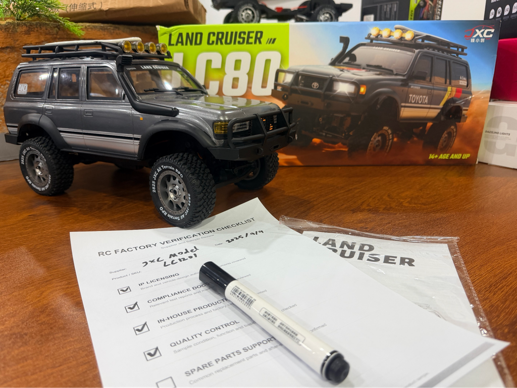 JXC Model LC80 Land Cruiser RC crawler with retail box and factory verification checklist