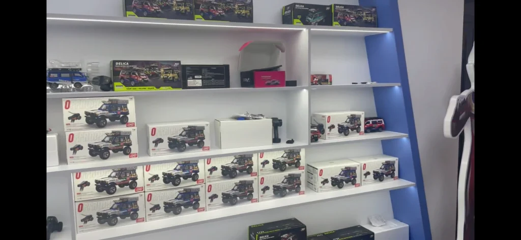 JXC licensed RC cars boxed on a retail store shelf ready for wholesale distribution