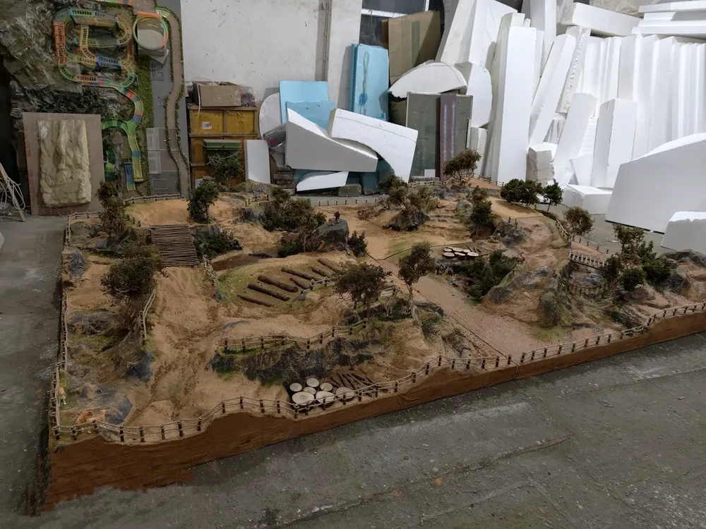 Indoor RC diorama track sections driven and checked during final inspection at the JXC Model facility